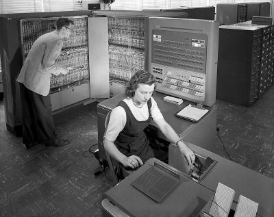 Black and white photo of a phone operator using a transcription machine